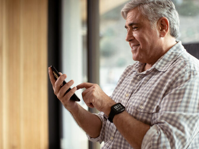 Person viewing masimo app on smartphone